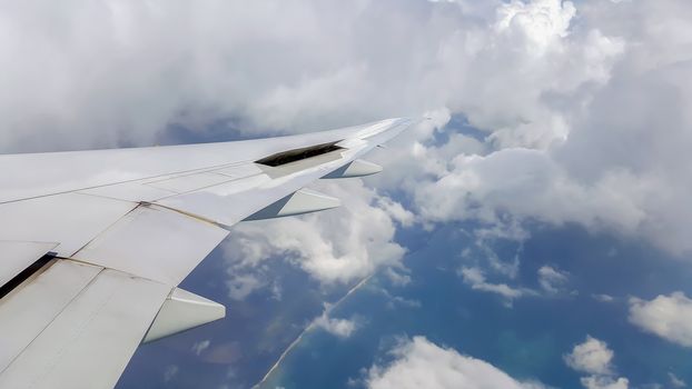 The view from the window of the plane while flying in the sky.