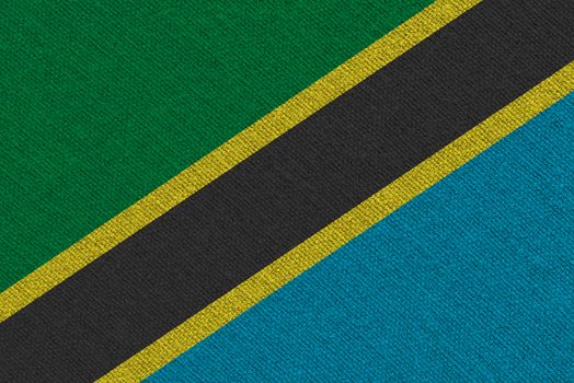 Tanzania fabric flag. Patriotic background. National flag of Tanzania