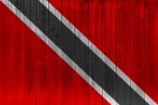 Trinidad and Tobago flag painted on old wood plank. Patriotic background. National flag of Trinidad and Tobago