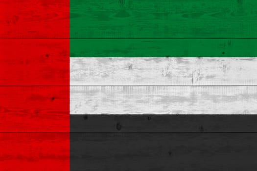 United arab flag painted on old wood plank. Patriotic background. National flag of United arab