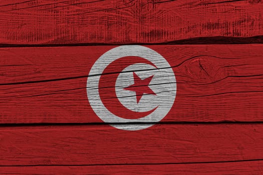 Tunisia flag painted on old wood plank. Patriotic background. National flag of Tunisia