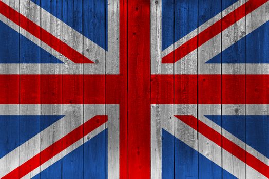 United Kingdom flag painted on old wood plank. Patriotic background. National flag of United Kingdom