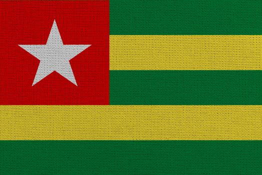 Togo fabric flag. Patriotic background. National flag of Togo