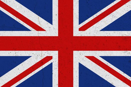 United Kingdom flag on concrete wall. Patriotic grunge background. National flag of United Kingdom