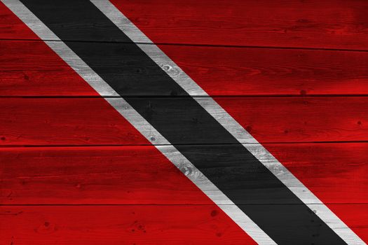 Trinidad and Tobago flag painted on old wood plank. Patriotic background. National flag of Trinidad and Tobago