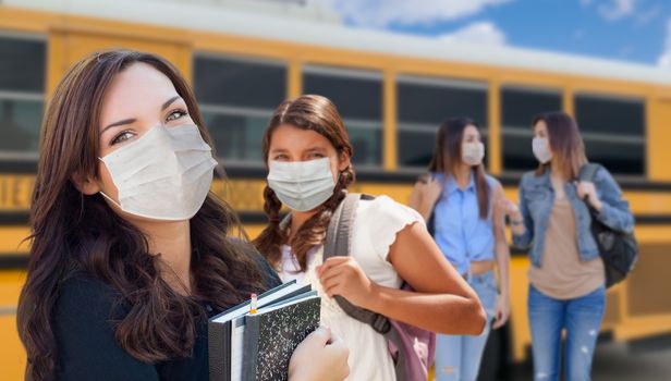 Students Near School Bus Wearing Medical Face Masks During Coronavirus Pandemic