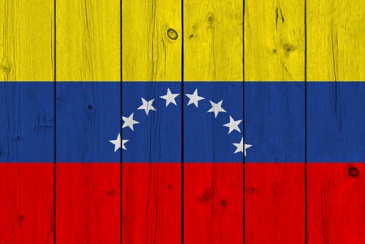 Venezuela flag painted on old wood plank. Patriotic background. National flag of Venezuela