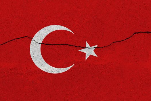 Turkey flag on concrete wall with crack. Patriotic grunge background. National flag of Turkey