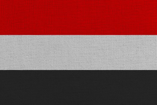 Yemen fabric flag. Patriotic background. National flag of Yemen