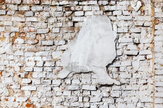 old brick wall with white plaster - full frame background and texture.