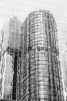 Black and white reflection of the International Towers in Sydney on the glass windows of a nearby skyscraper