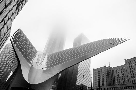 Black and white low angle view of the World Trade Centre in a foggy and cloudy day. Manhattan, New York, USA