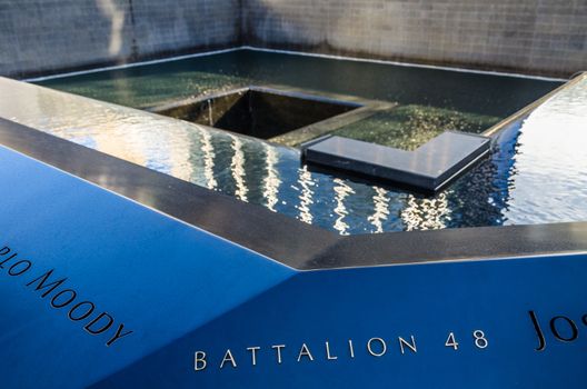 View of the 9 11 Memorial next to the One World trade centre in Manhattan, New York