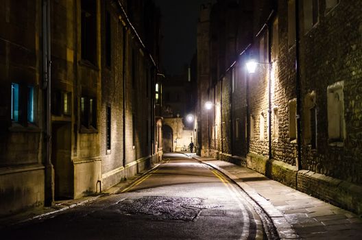 An empty illuminated Trinity Lane at night, Cambridge, United Kingdom