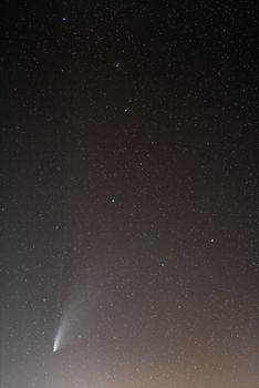 Neowise Comet and its two long tails below Ursa Major constellation. 35mm lens and photo stacking. Sicily, Italy