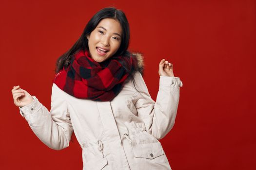 Happy woman with a scarf on her neck smiling at camera model