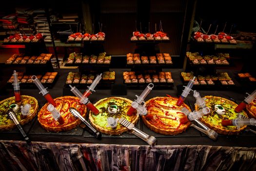 Scary catering with pizza and other horror snacks for Halloween