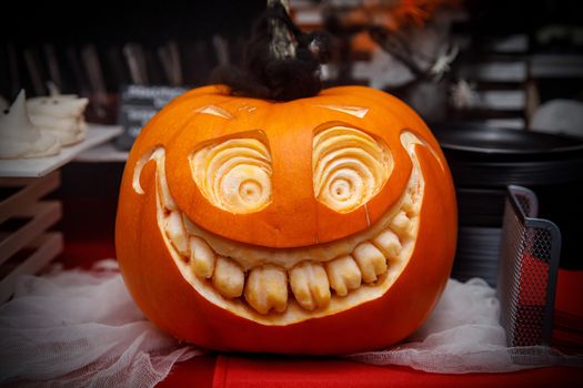Smiling pumpkin with teeth on Halloween