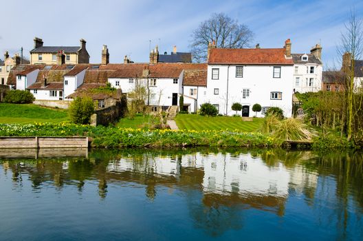 White cottages on river Cam in a sunny day, Cambridge, United Kingdom