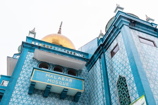 Low angle view of the blue Malabar Mosque in Singapore