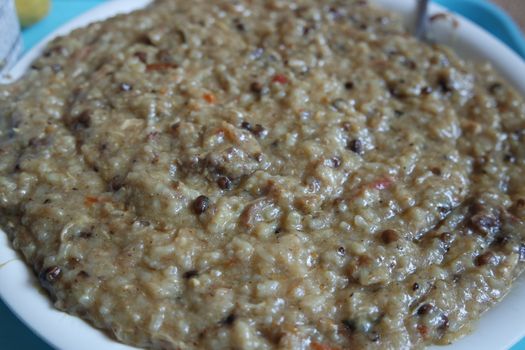 A close up view of Cooked white rice called Kichra served with green mint with traditional Charsadda recipe popular for its delicious taste in Pakistan