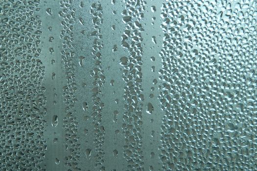 Bright grey color glassy texture, with water drops on it. Water drop glassy background