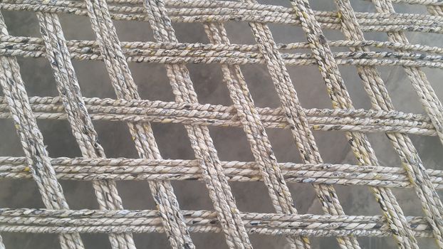 Closeup view of dried jute thread or ropes interwoven for making traditional old style bed called charpai