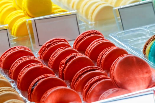 Tasty french macarons on a wooden table with vintage color tone, Macarons is a French sweet meringue based Sweet colorful macarons