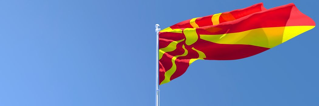 3D rendering of the national flag of Macedonia waving in the wind against a blue sky