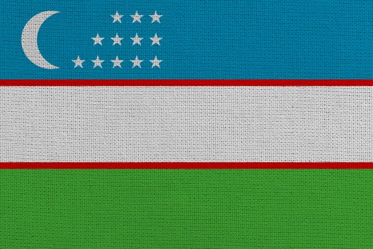 Uzbekistan fabric flag. Patriotic background. National flag of Uzbekistan