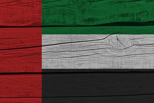 United arab flag painted on old wood plank. Patriotic background. National flag of United arab