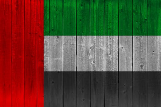 United arab flag painted on old wood plank. Patriotic background. National flag of United arab