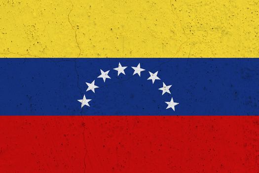 Venezuela flag on concrete wall. Patriotic grunge background. National flag of Venezuela