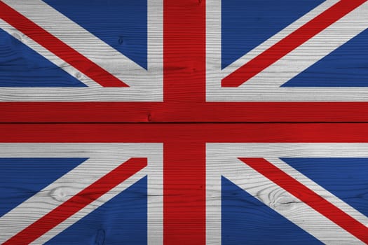 United Kingdom flag painted on old wood plank. Patriotic background. National flag of United Kingdom