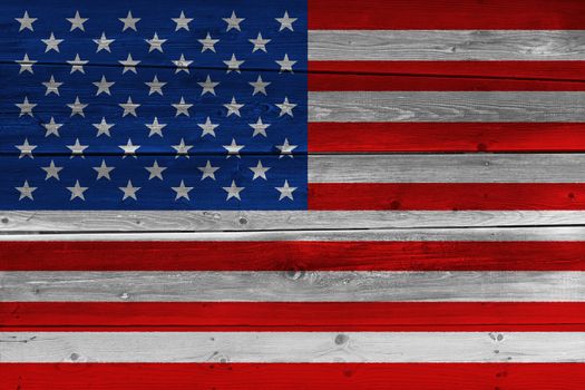 United States of America flag painted on old wood plank. Patriotic background. National flag of United States of America