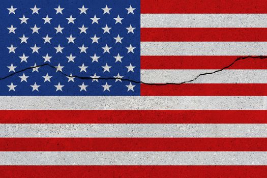 United States of America flag on concrete wall with crack. Patriotic grunge background. National flag of United States of America