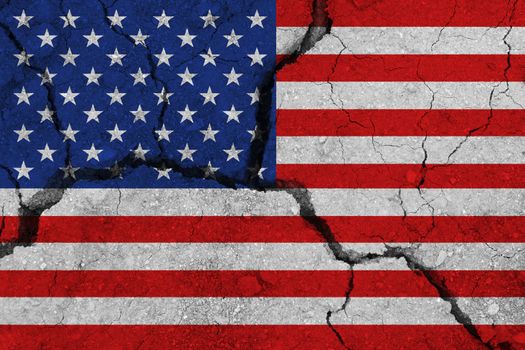 United States of America flag on the cracked earth. National flag of United States of America. Earthquake or drought concept