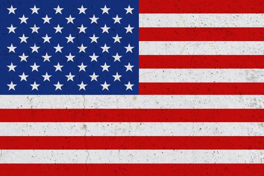 United States of America flag on concrete wall. Patriotic grunge background. National flag of United States of America