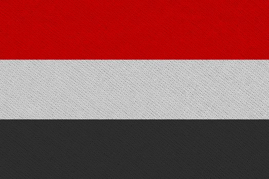 Yemen fabric flag. Patriotic background. National flag of Yemen