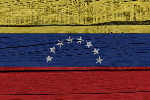 Venezuela flag painted on old wood plank. Patriotic background. National flag of Venezuela