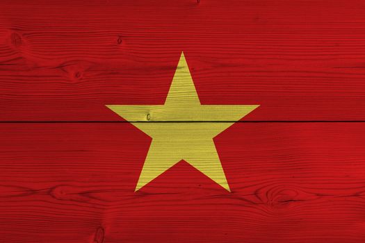 Vietnam flag painted on old wood plank. Patriotic background. National flag of Vietnam