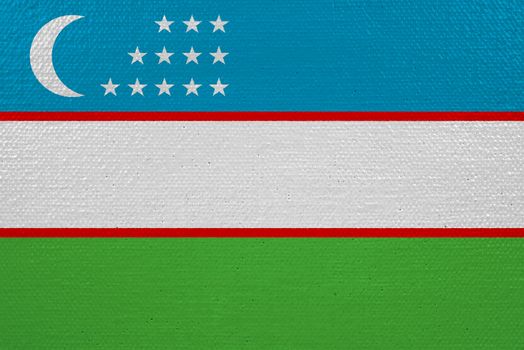 Uzbekistan flag on canvas. Patriotic background. National flag of Uzbekistan