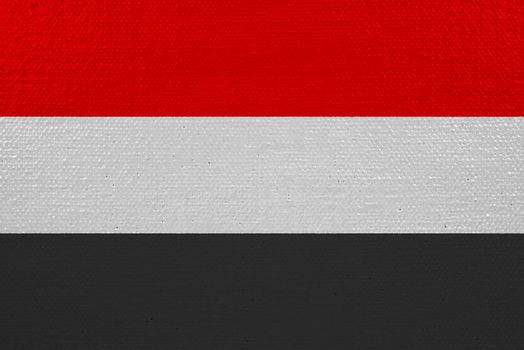 Yemen flag on canvas. Patriotic background. National flag of Yemen