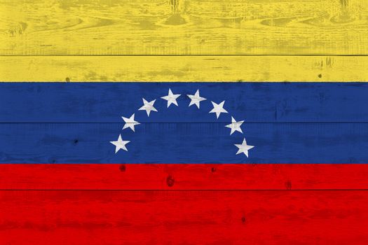 Venezuela flag painted on old wood plank. Patriotic background. National flag of Venezuela