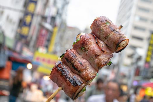 The close up of Taiwanese traditional barbecue (BBQ) food  at night market background in Taiwan.