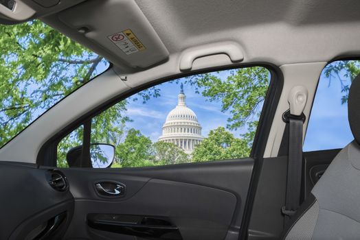 Looking through a car window with view of United States Capitol building, iconic home of the United States Congress, Washington DC, USA