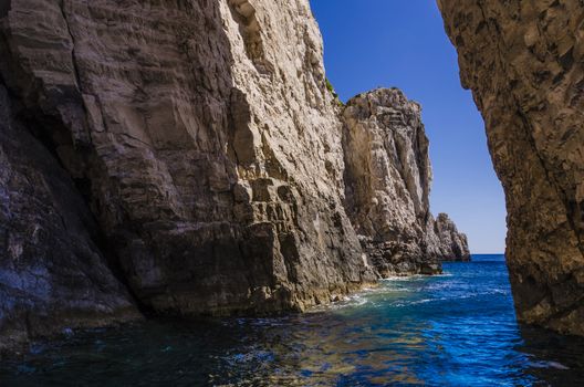 sailing between maritime cliffs on the shores of the island of zakynthos in the Ionian Sea