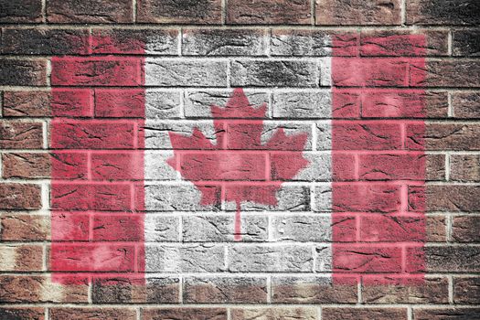 A Canada flag on a brick wall background
