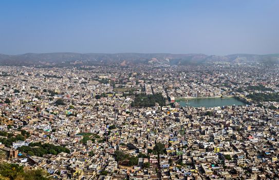 Ariel view of densely crowded colorful houses in Jaipur city in Uttar Pradesh, India.