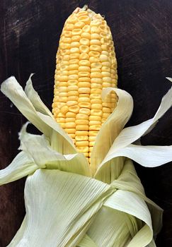 Isolated view of corn maize kept in a plate for cooking after removing the outer skin like leaves